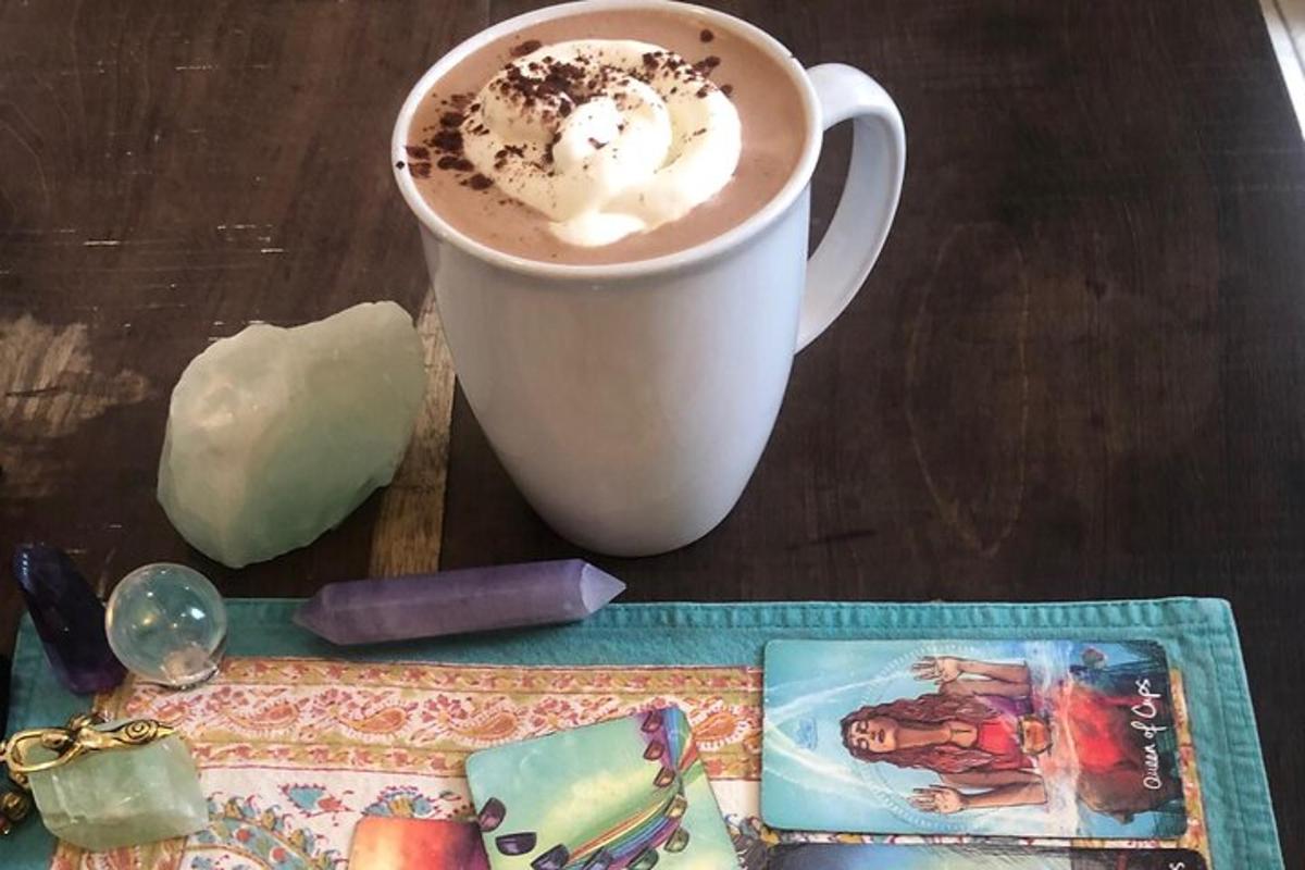 a cup of coffee sitting on top of a wooden table