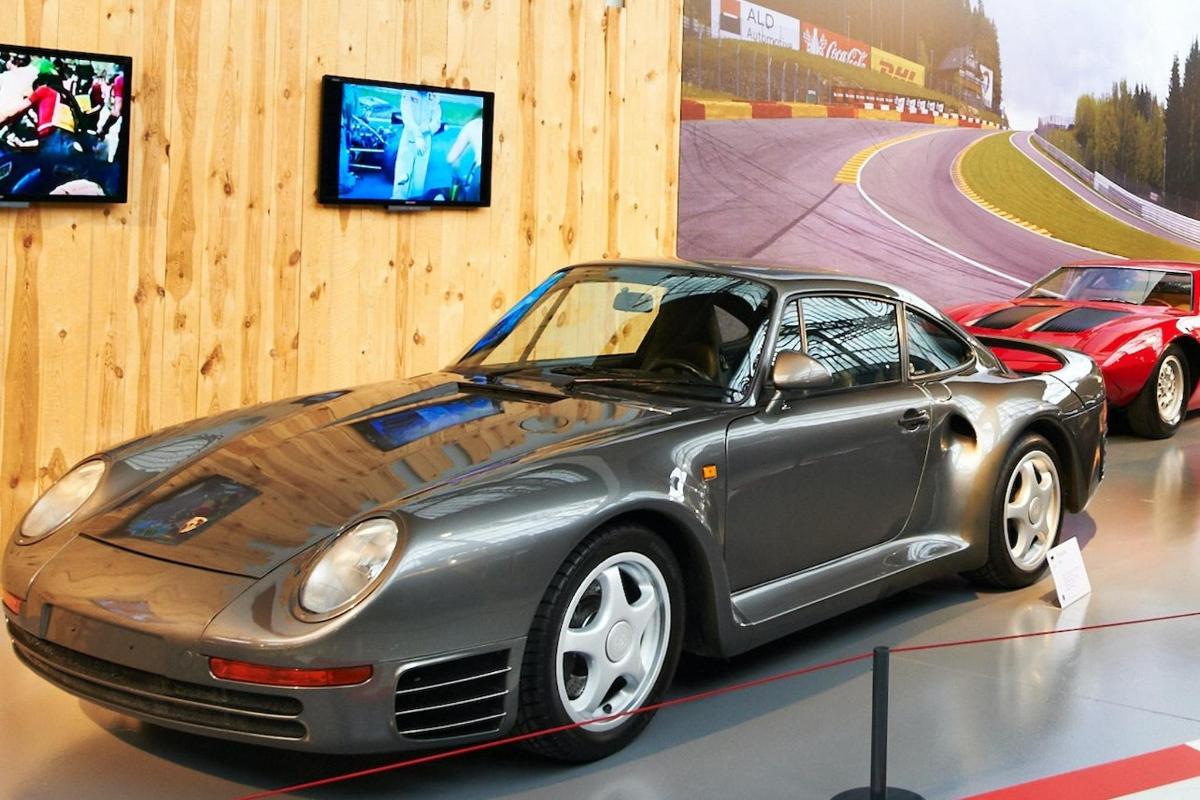 a porsche car on display in a museum