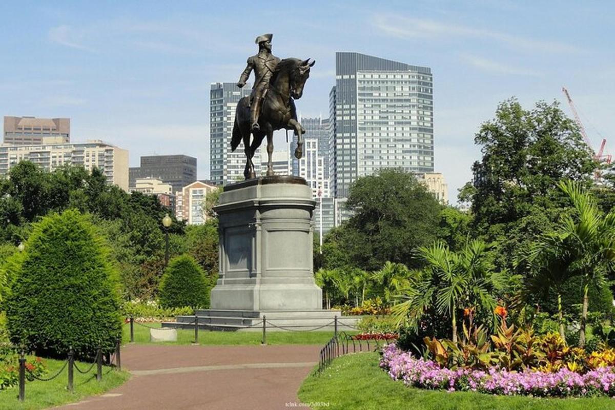 a statue of a man riding a horse in a park