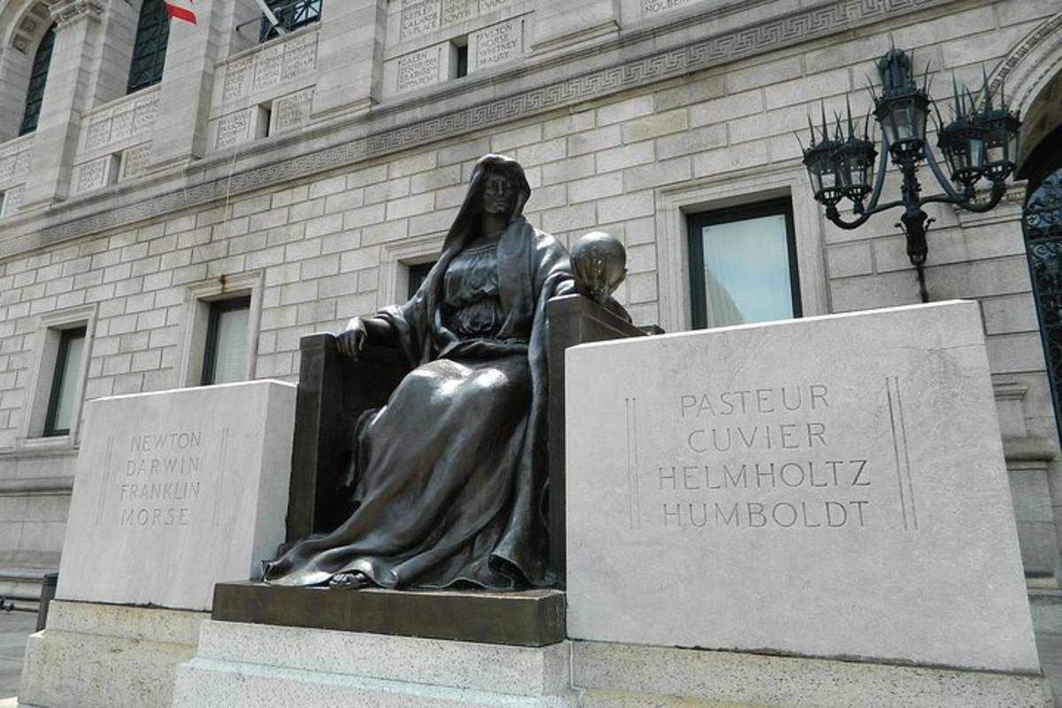 a statue of a woman in front of a building