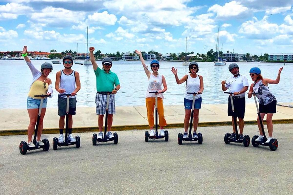 a group of people riding on segifts by the water