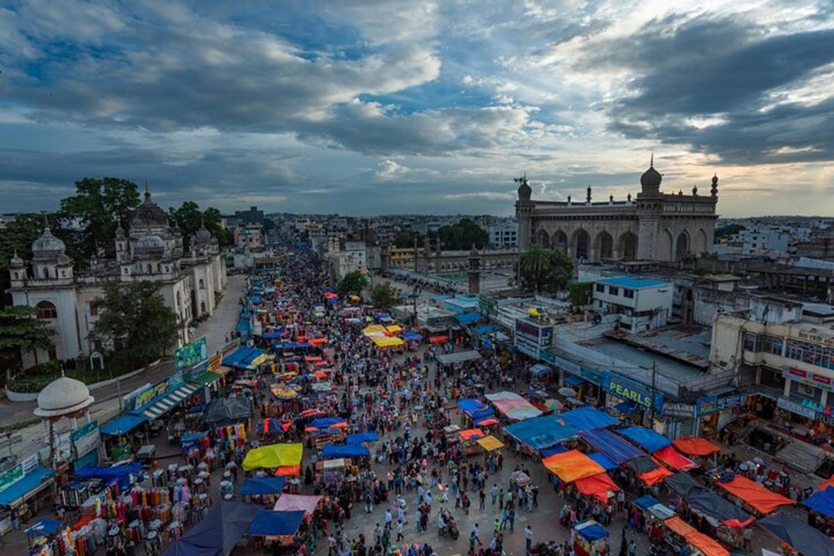 a crowd of people at a market in a city
