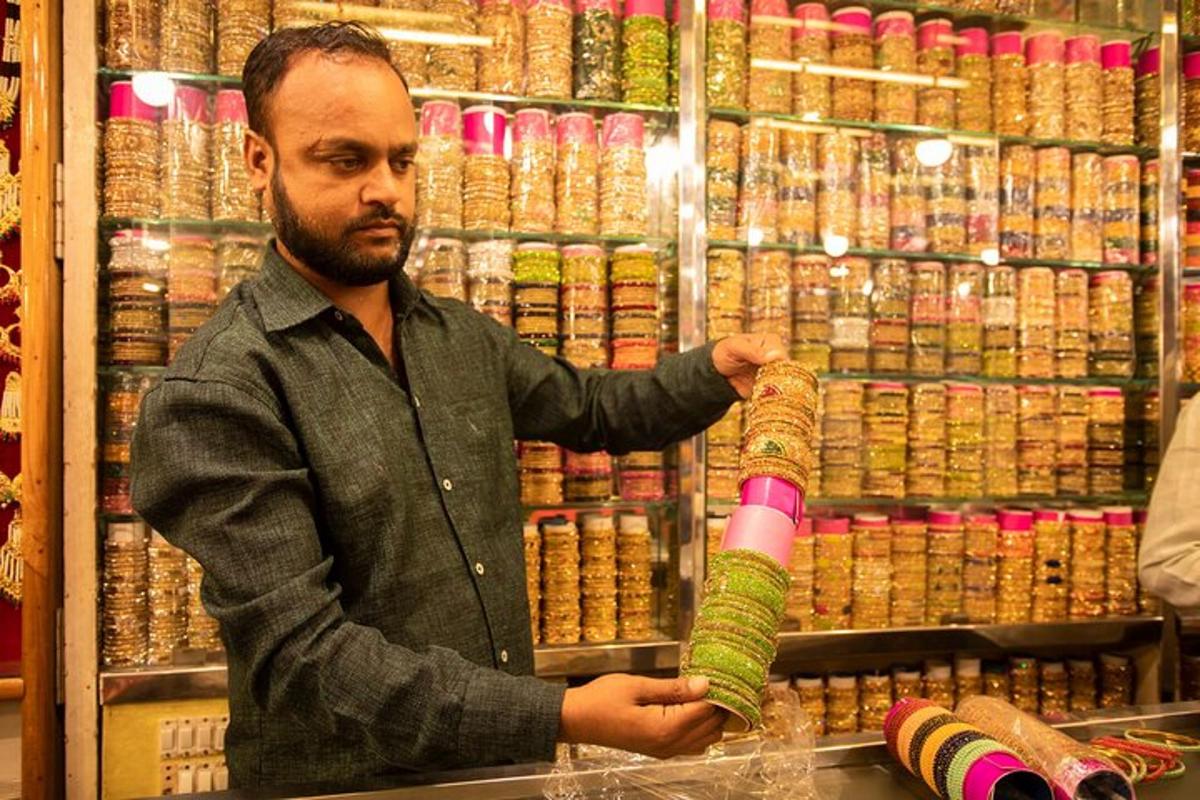 a man is holding a sock in a store