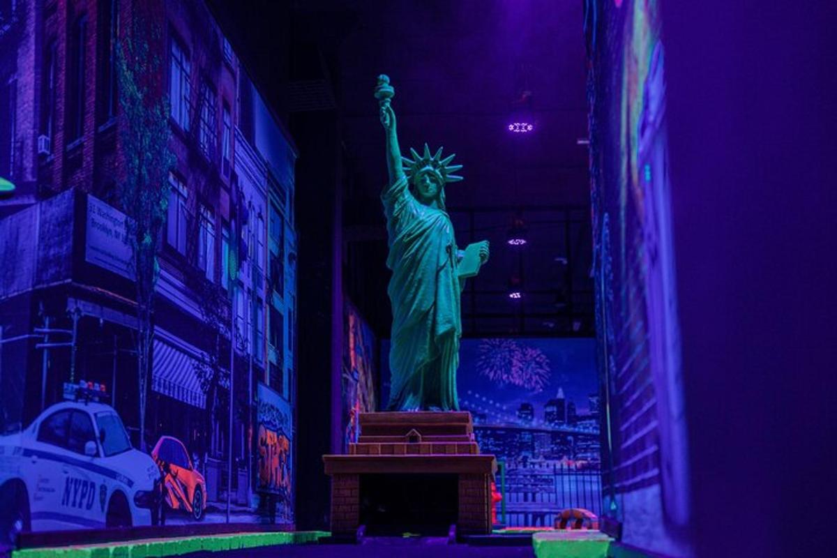 a statue of liberty in a room with purple lights