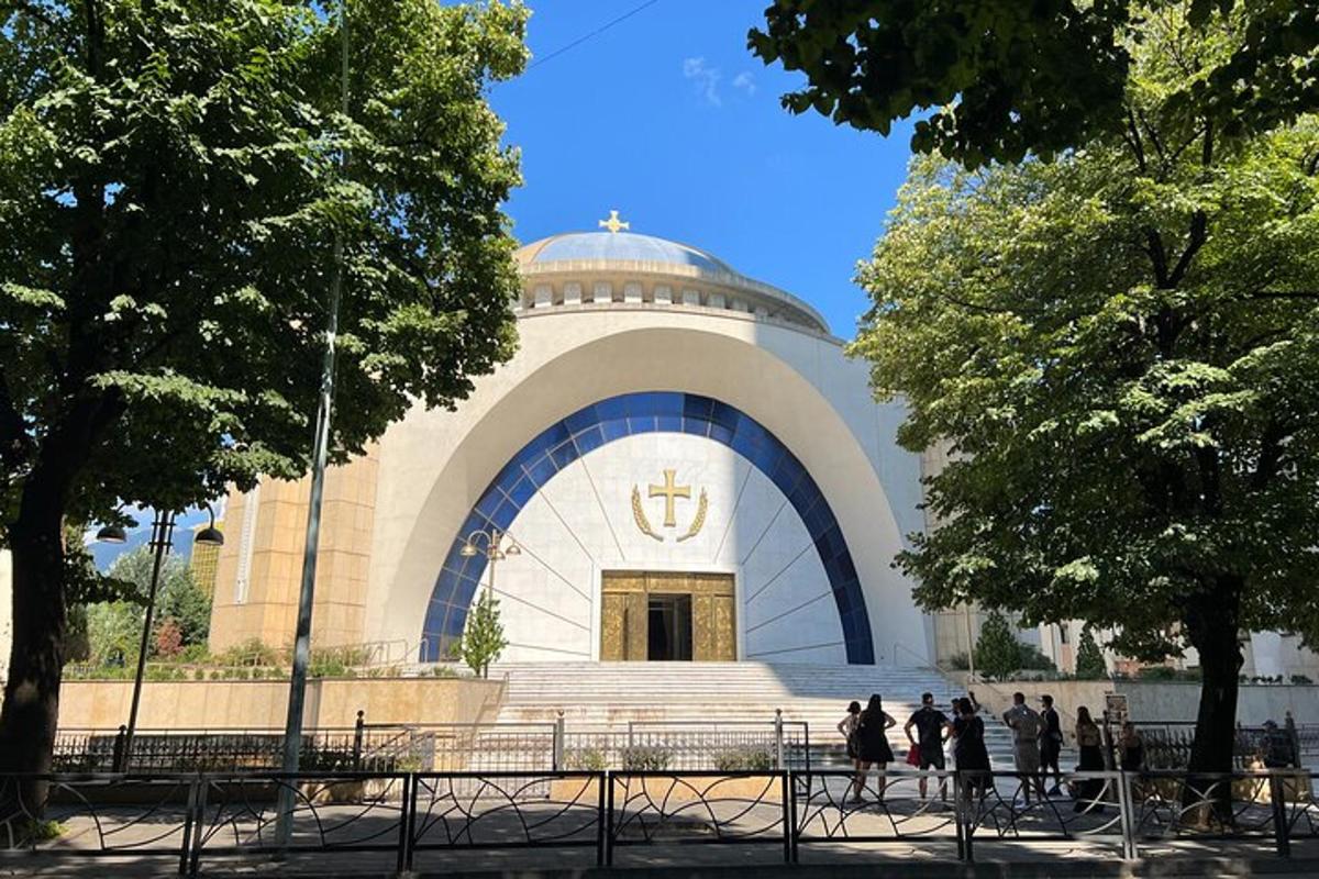a large building with people walking in front of it