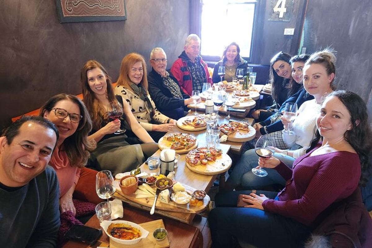a group of people sitting around a table eating