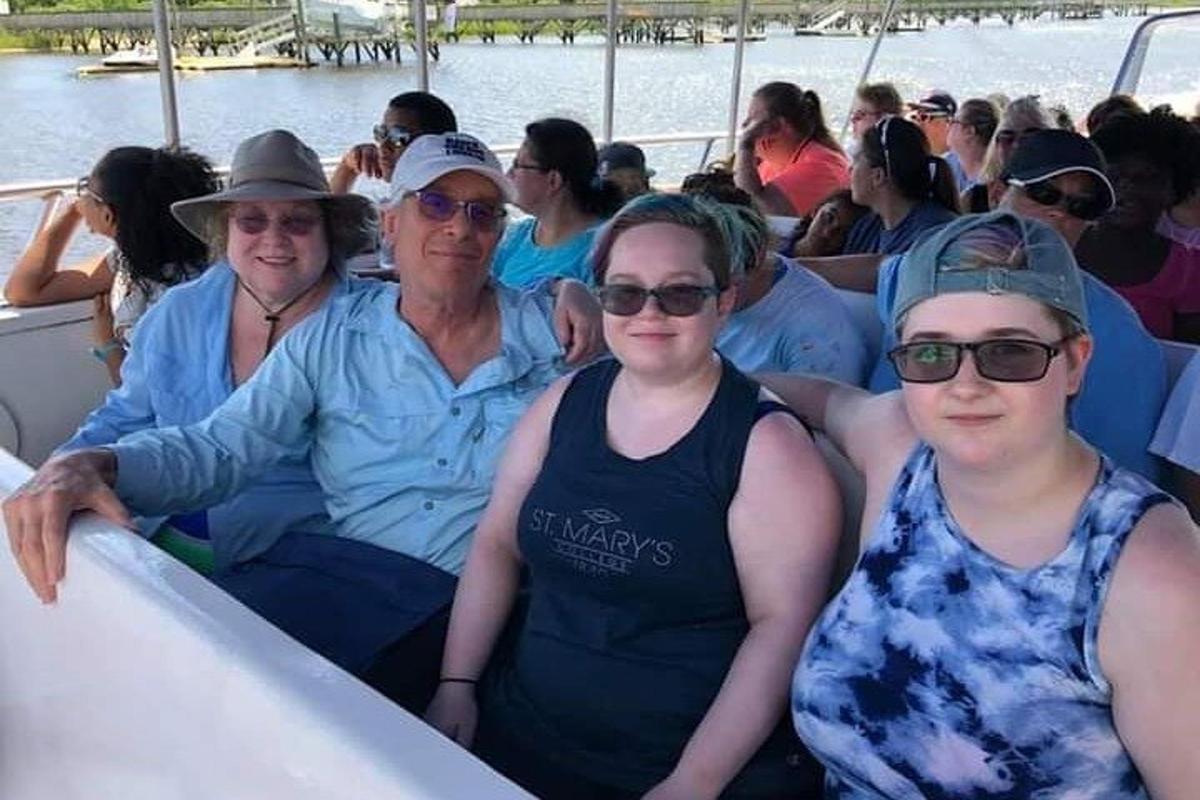 a group of people sitting in a boat