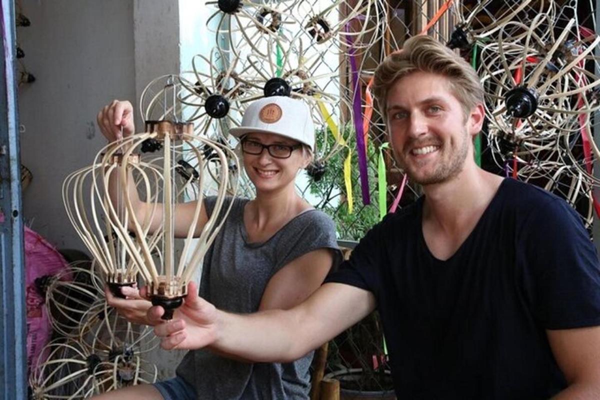 a man and a woman holding a glass object