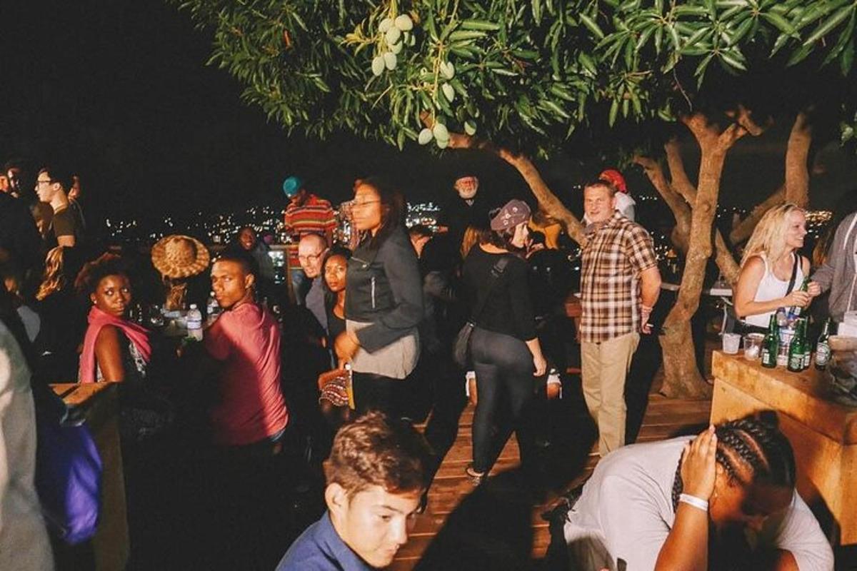 a group of people standing around at a party