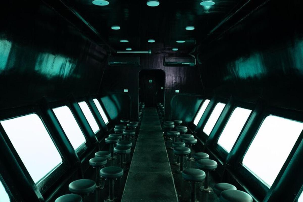 a row of seats in a train with windows