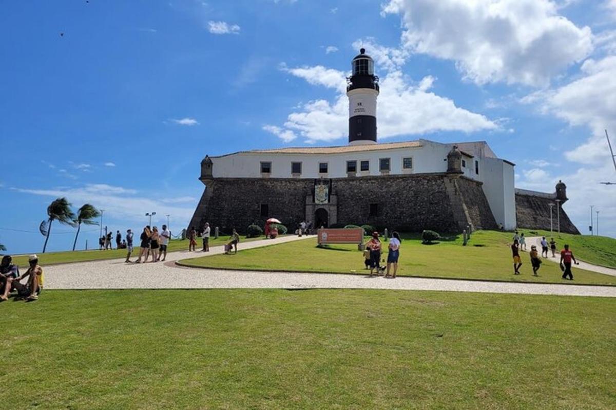 a lighthouse on top of a building with a crowd of people