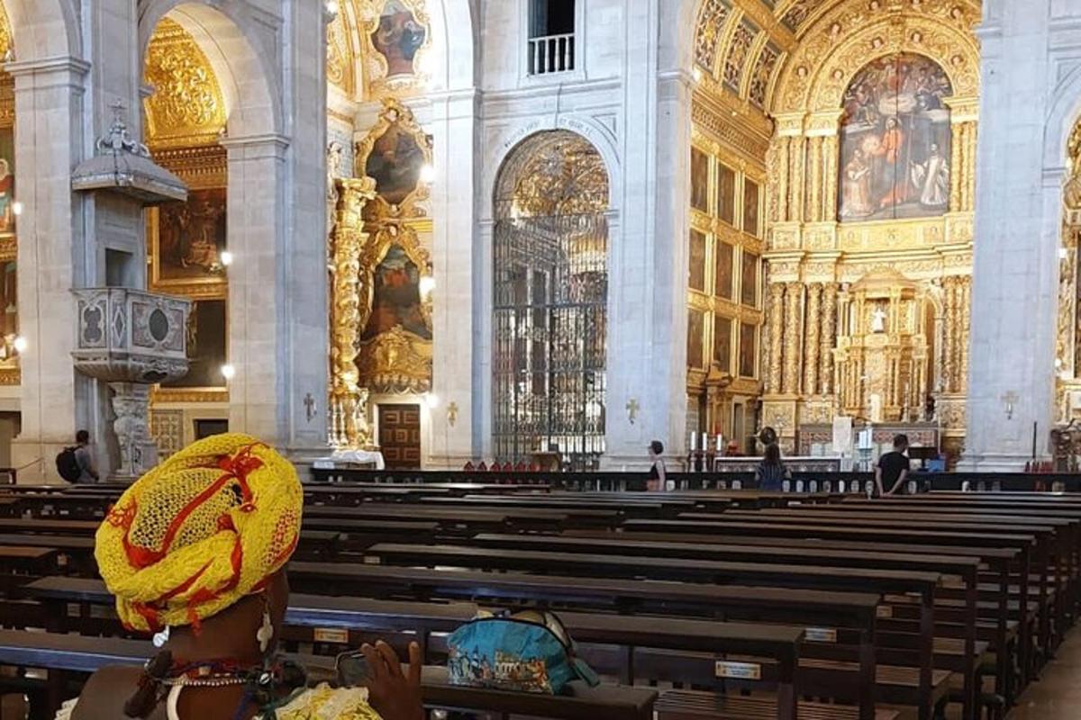 a person wearing a hat sitting in a church