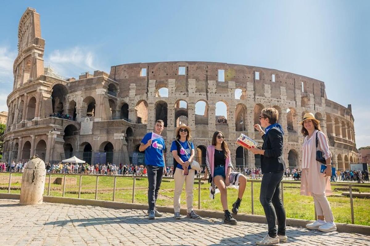 a group of people standing in front of the coliseum