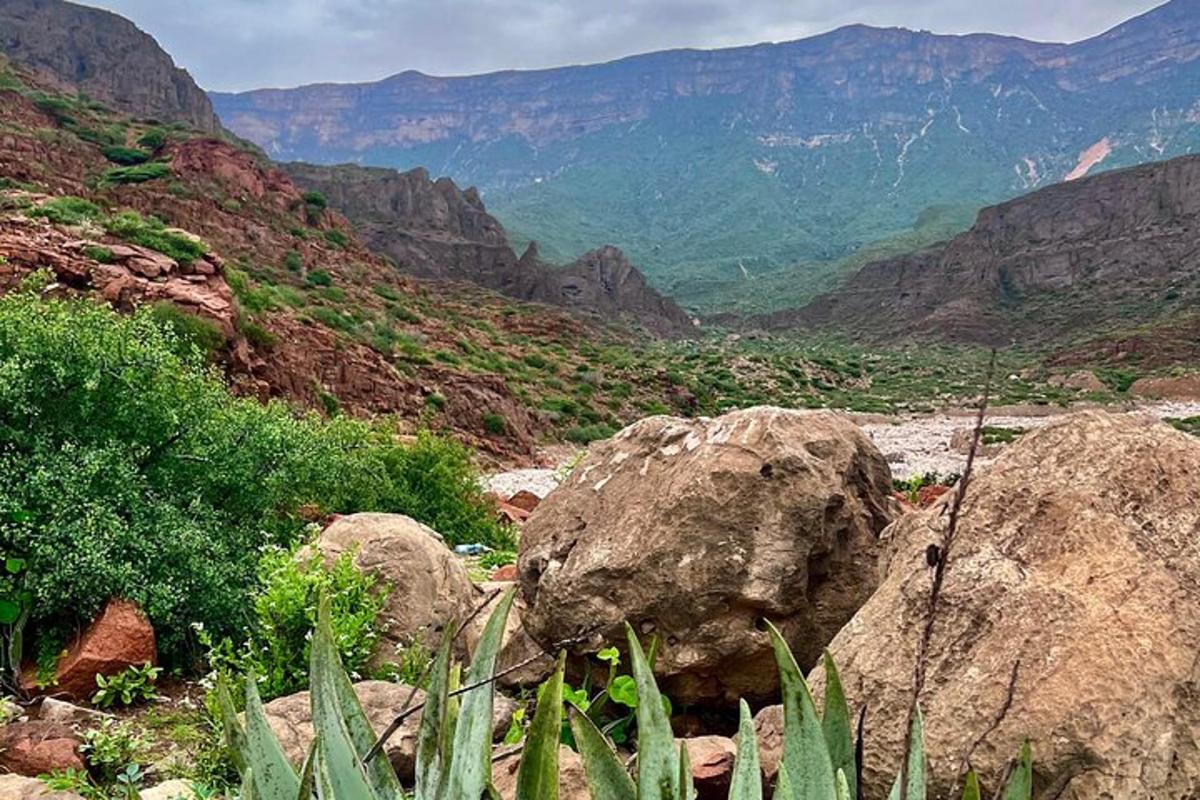 a view of a canyon with rocks and mountains