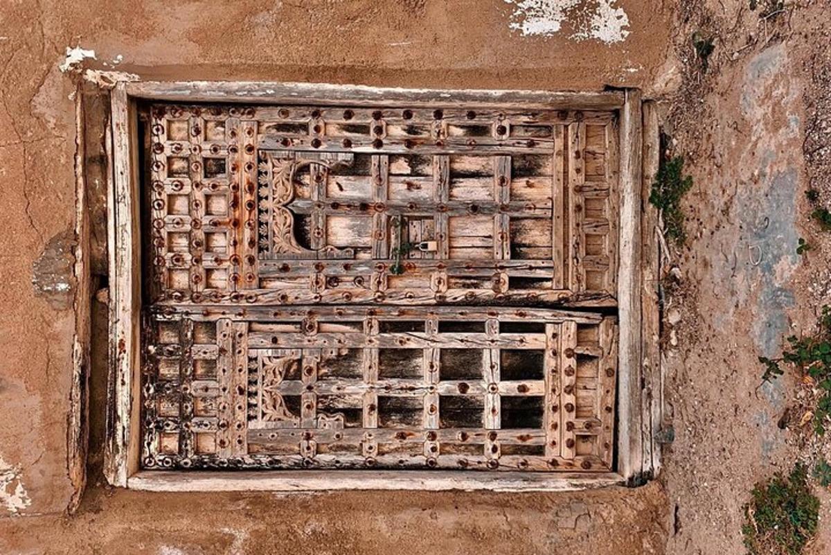 a wooden window on the side of a building