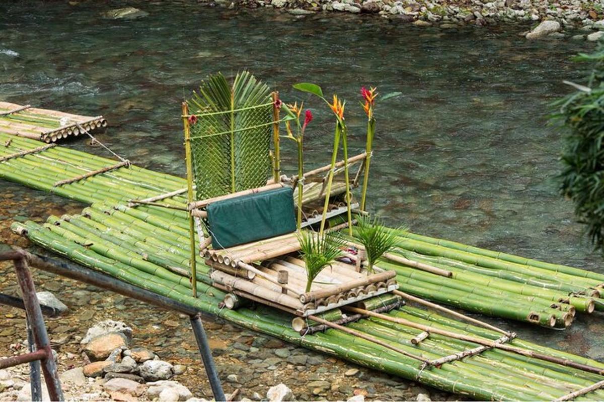 a chair sitting on a raft next to a river