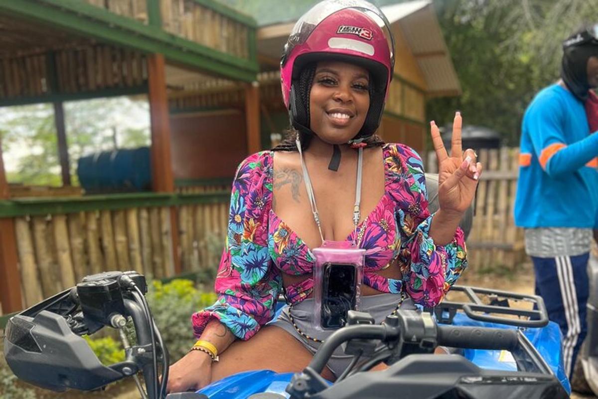 a woman wearing a helmet on a motorcycle