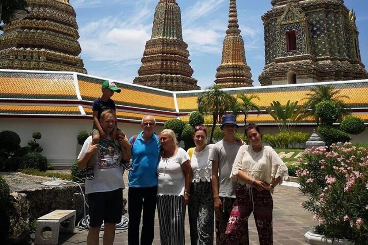 a group of people standing in front of a temple