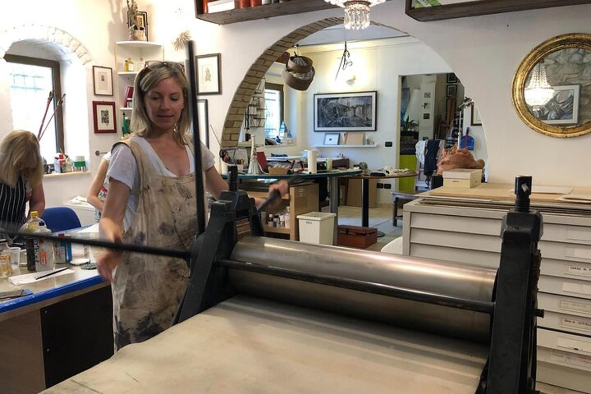 a woman standing in a shop with a metal item
