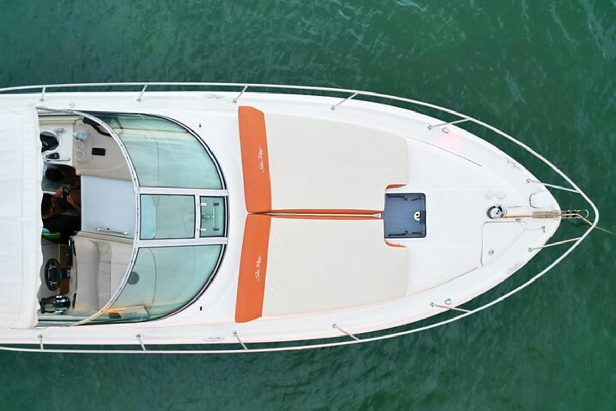 a white boat in the middle of the water