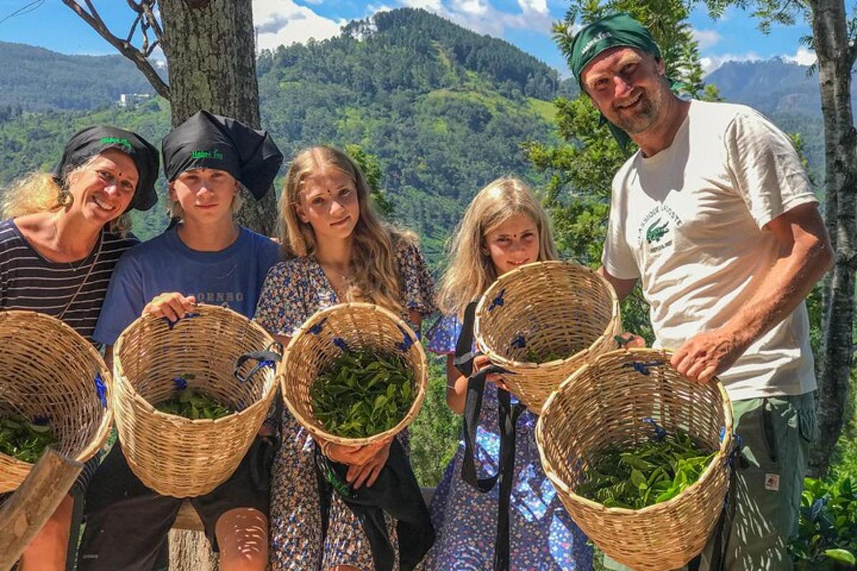 a group of people standing with baskets of greens