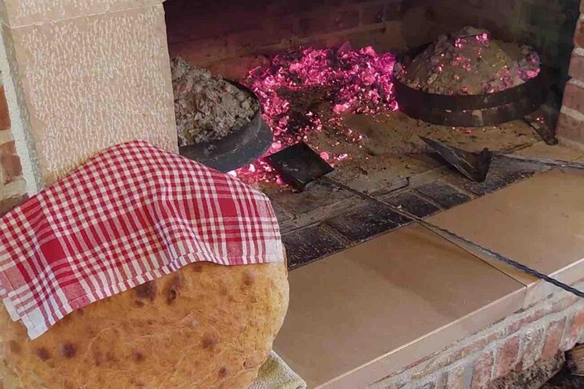 a brick oven with two cakes in it