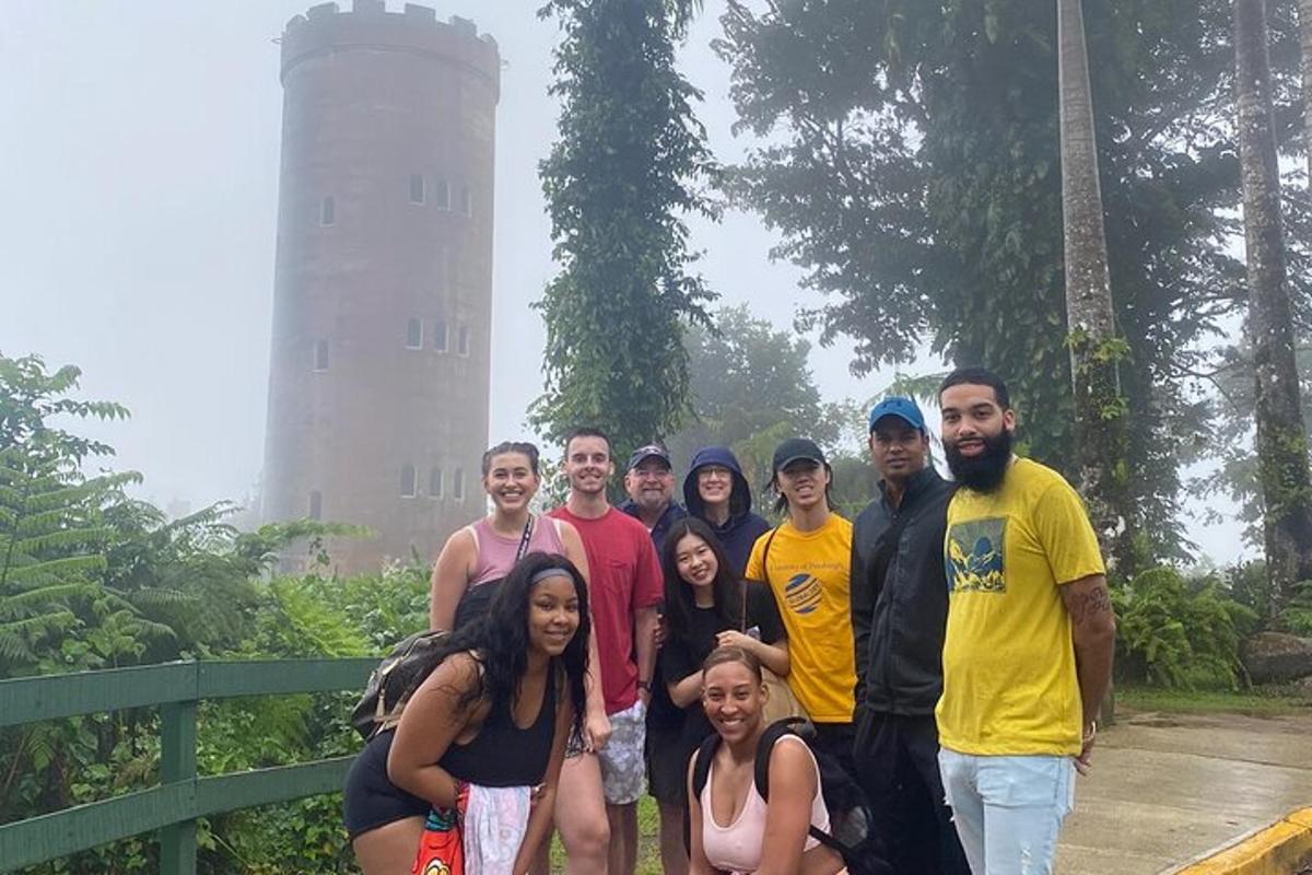 a group of people posing for a picture in the rain