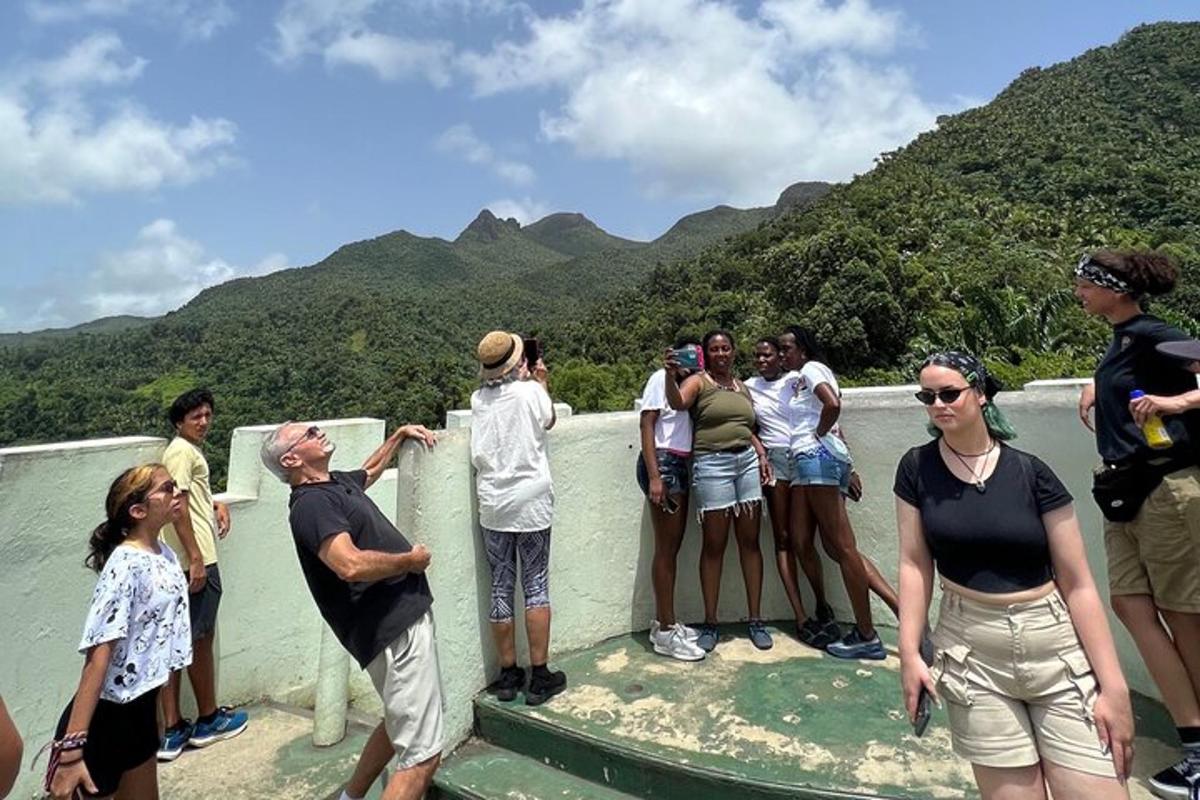 a group of people standing on top of a bridge