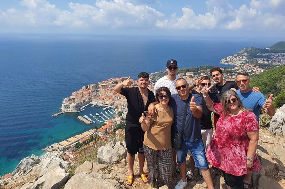 a group of people standing on top of a mountain