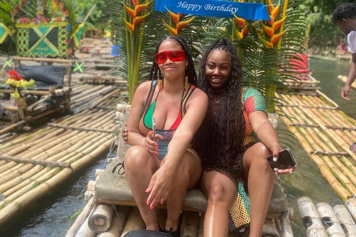 two women sitting on a raft in the water