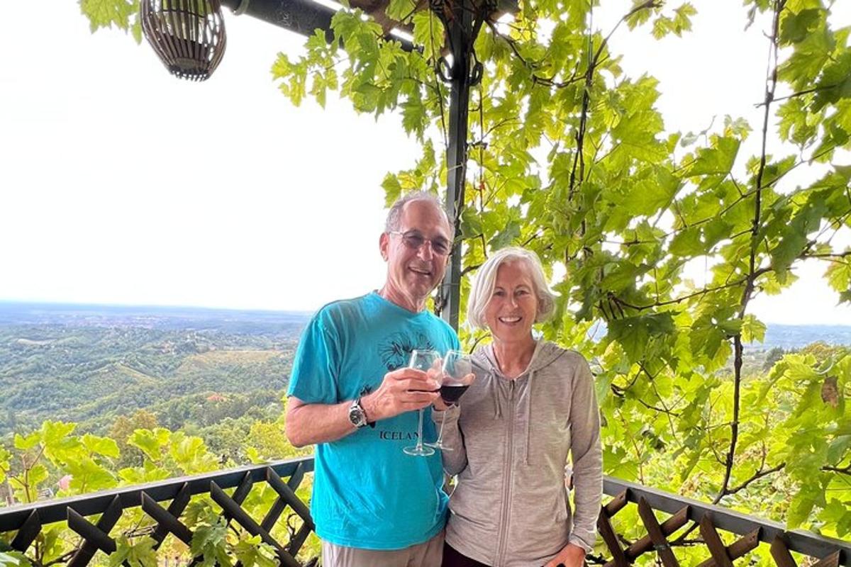 a man and a woman holding a glass of wine