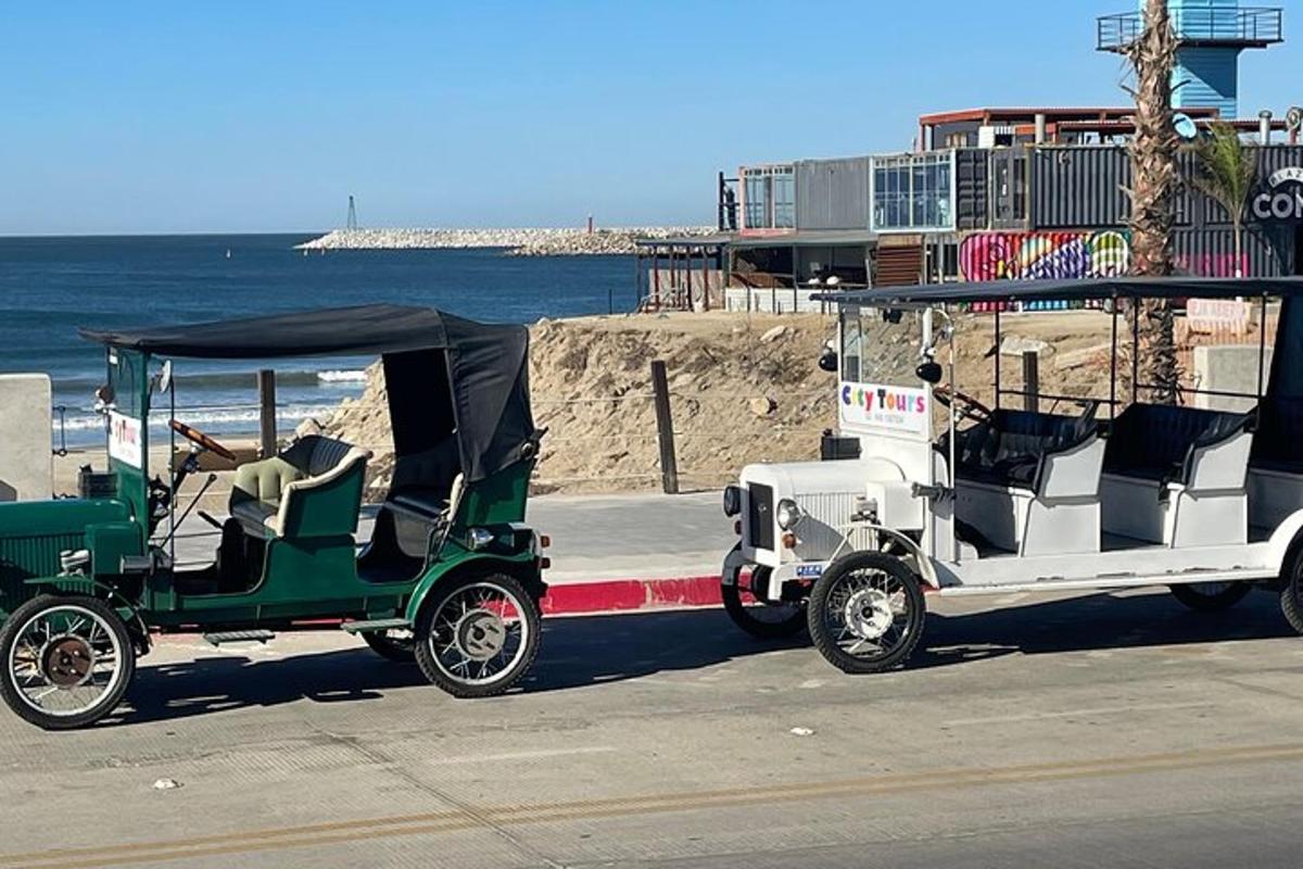 a golf cart parked next to the beach