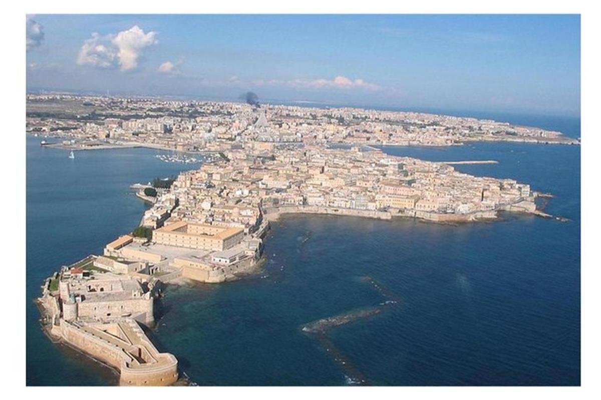 an aerial view of a city on the water