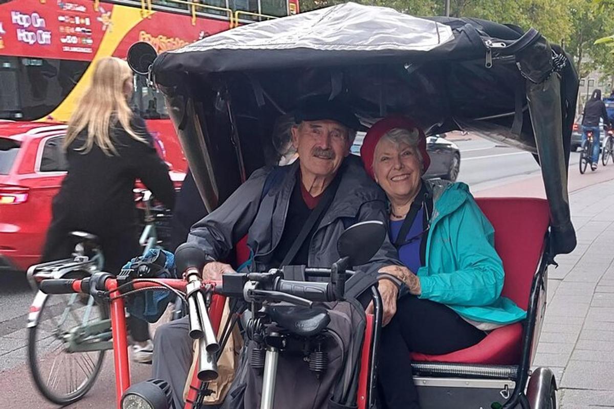 a man and a woman sitting in a carriage