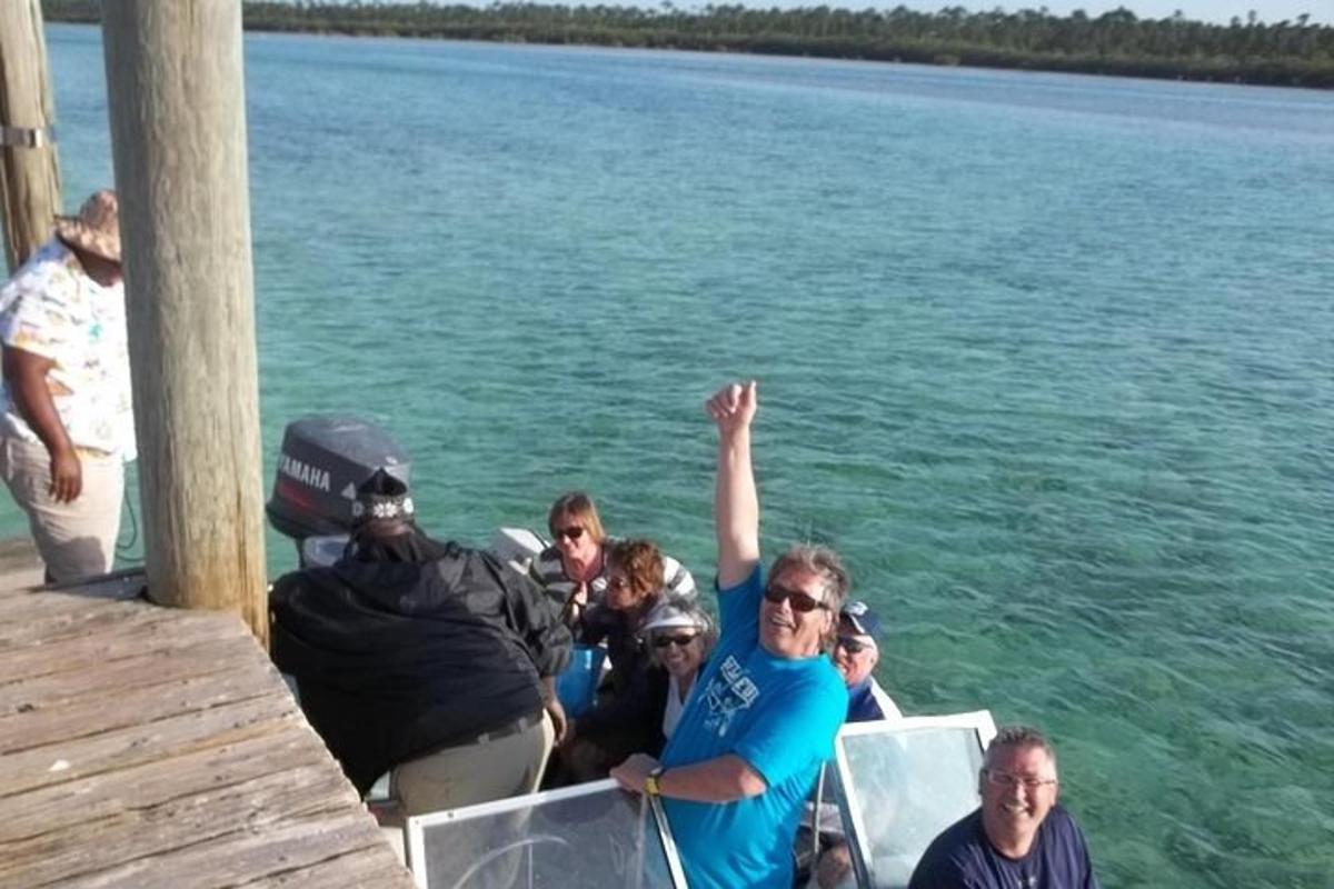 a group of people on a boat in the water