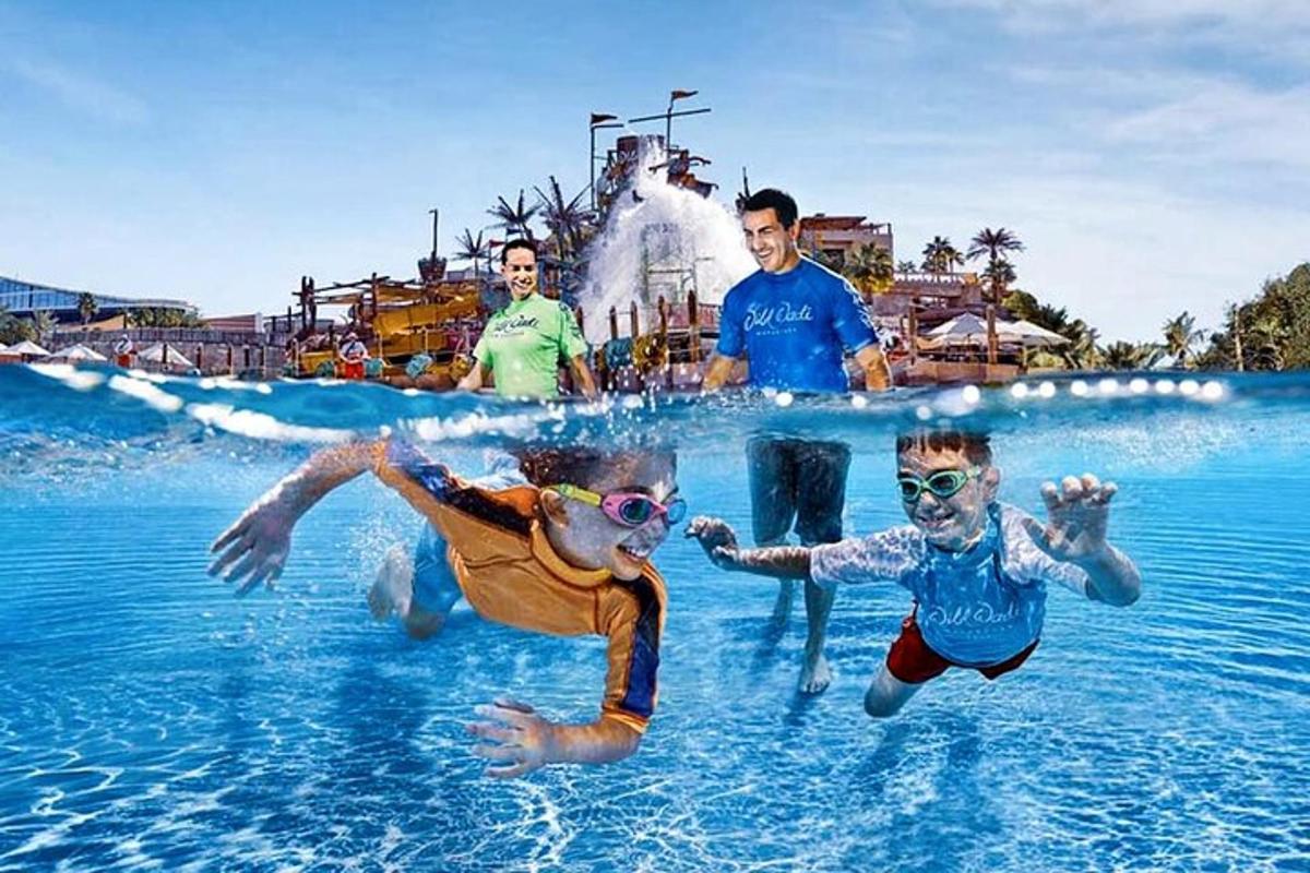 a group of people in the water at a water park