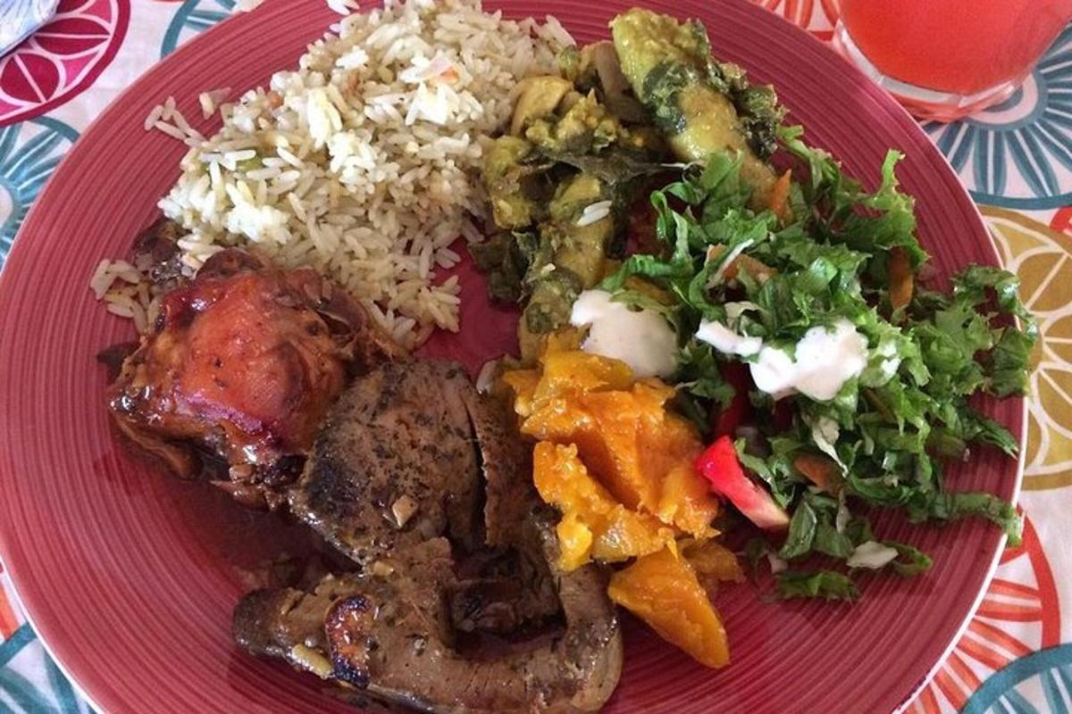 a red plate of food with rice and vegetables