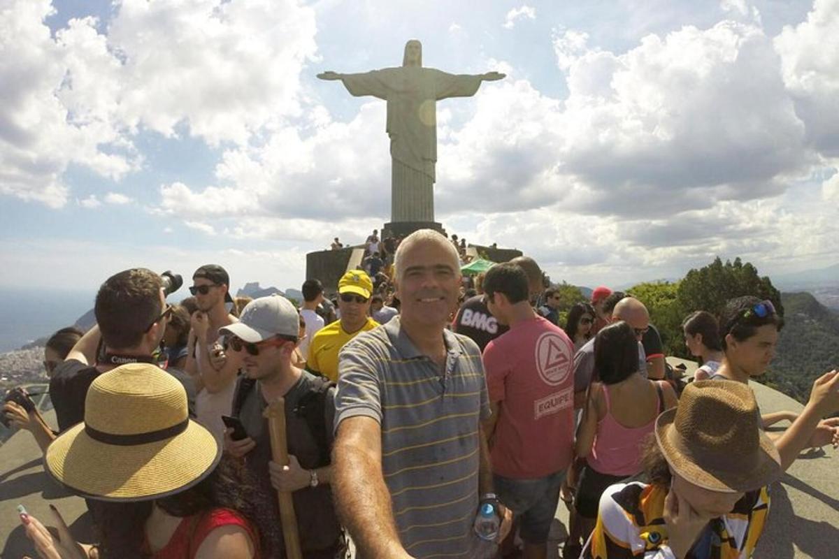a group of people standing in front of a statue