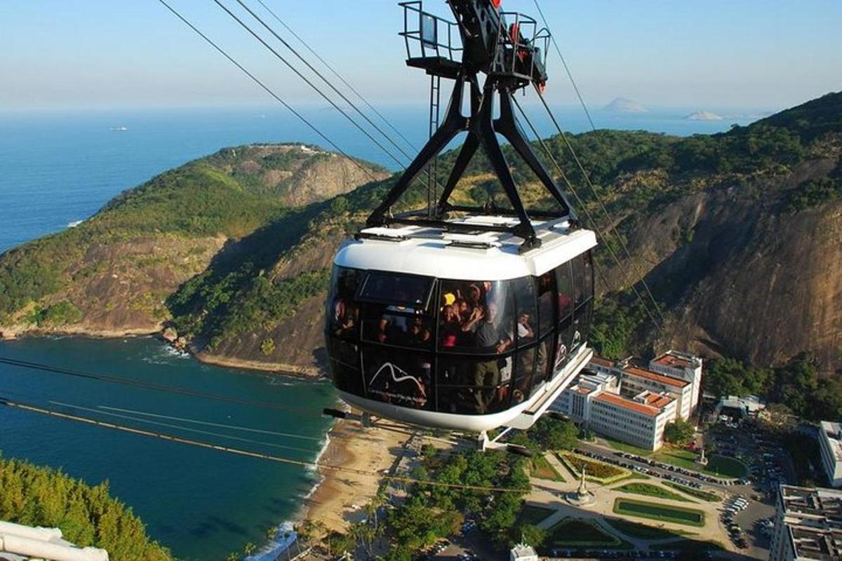 a cable car is flying over the ocean