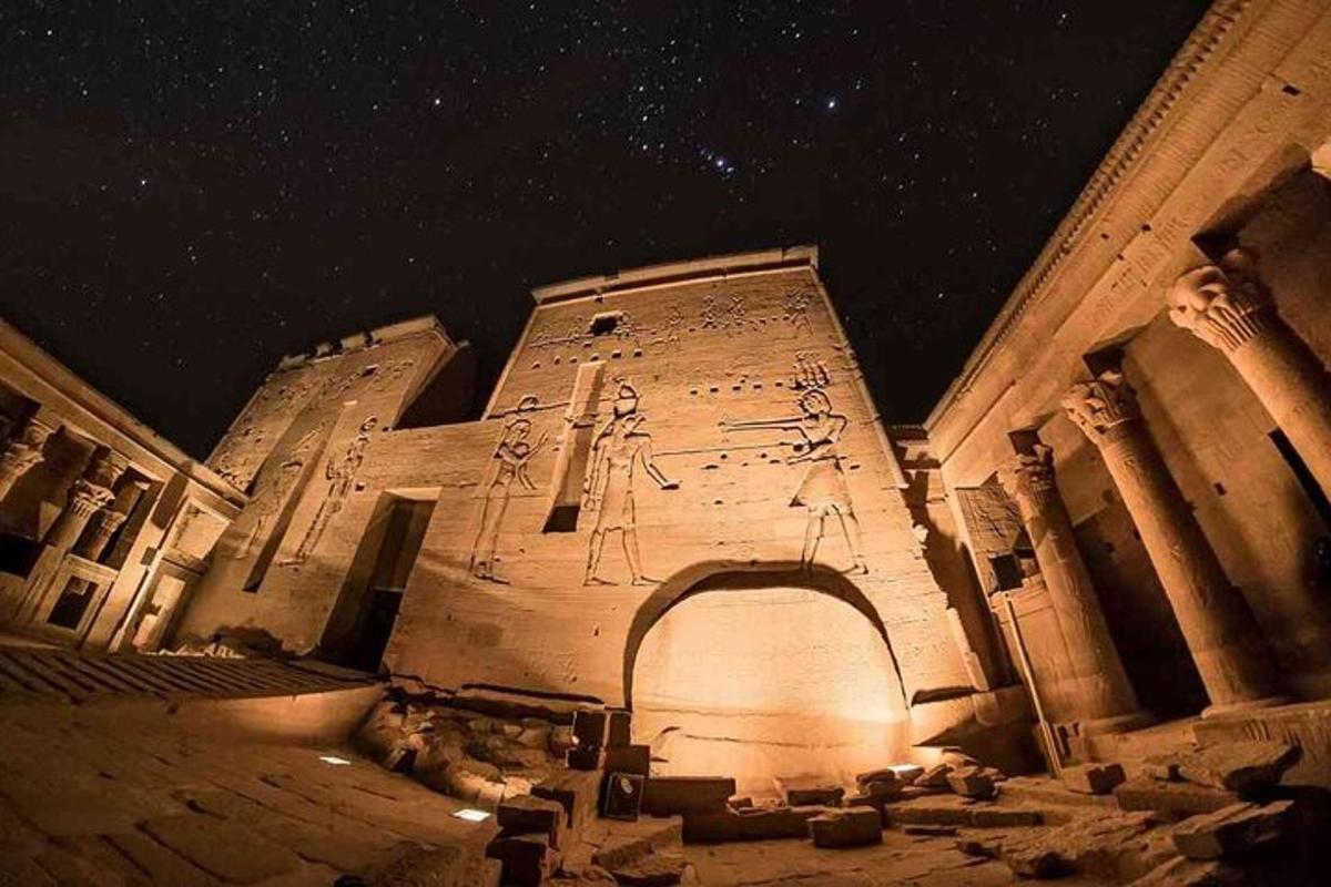 a building with writing on the side of it at night