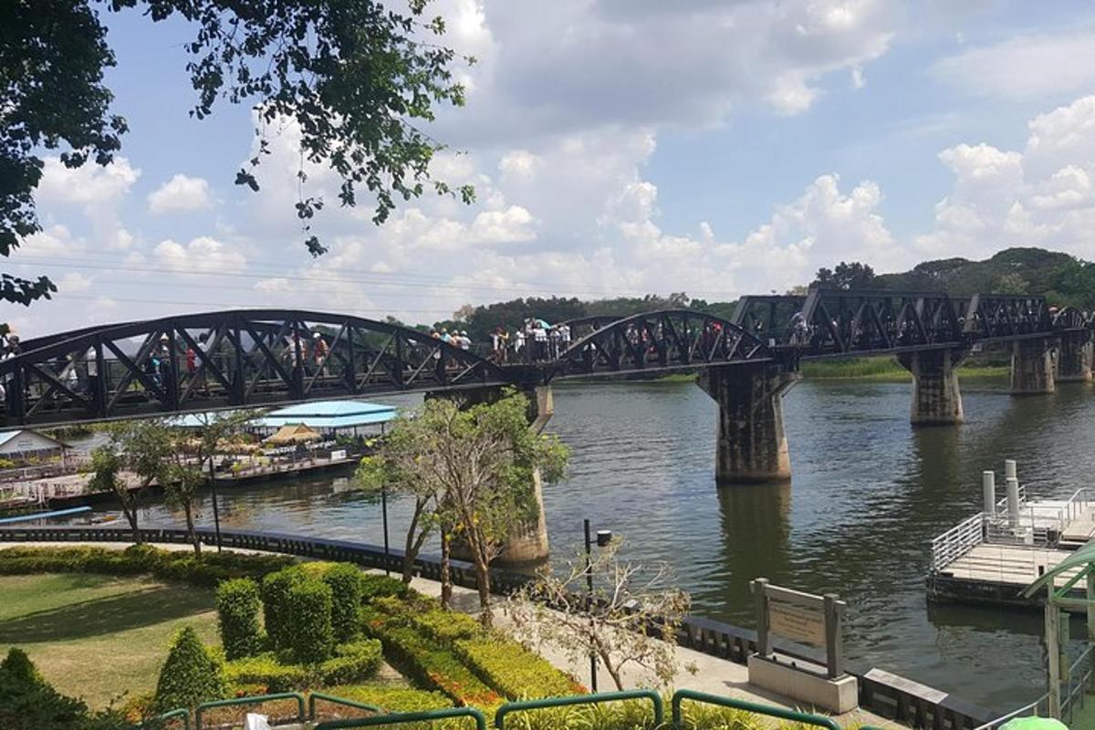 a bridge over a river with people walking on it