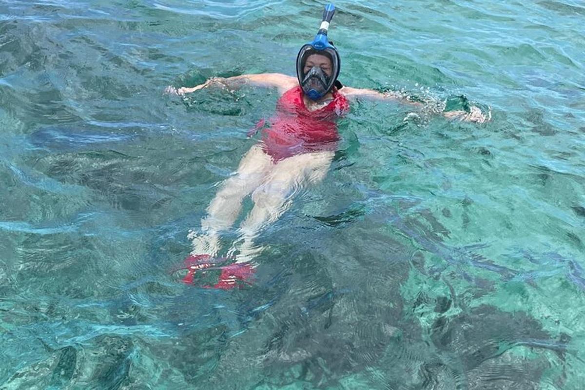 a man in the water with a helmet on