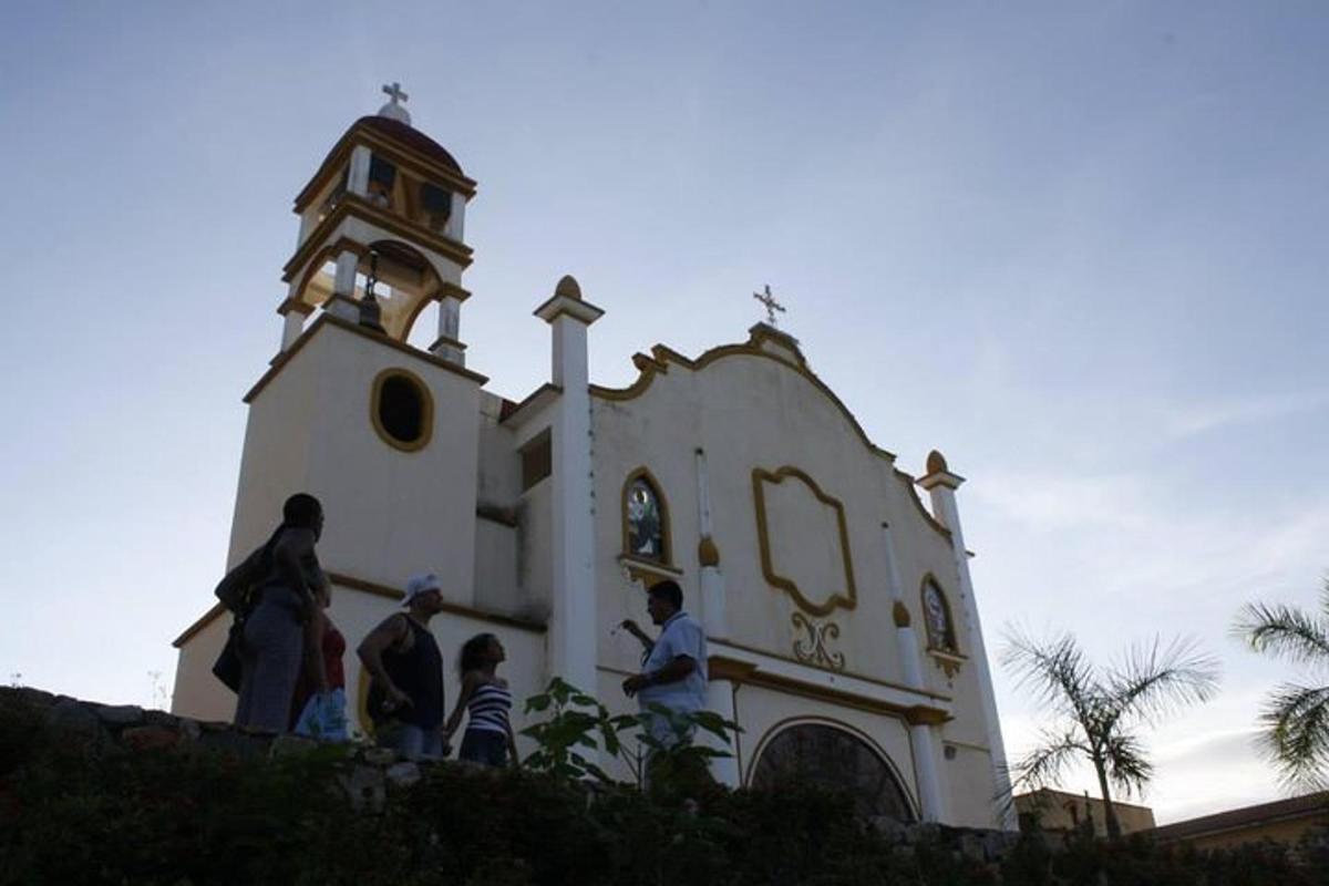 a group of people standing in front of a church