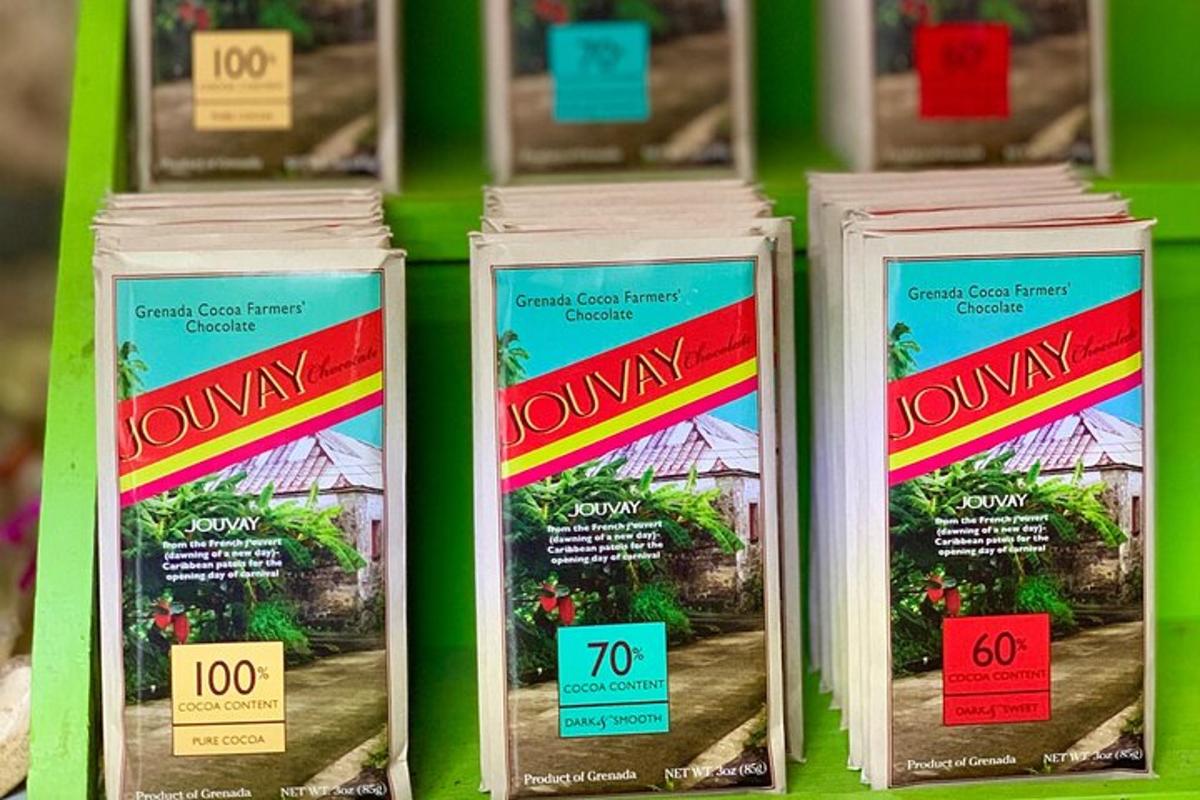 a row of containers of townlyn flowers on a shelf