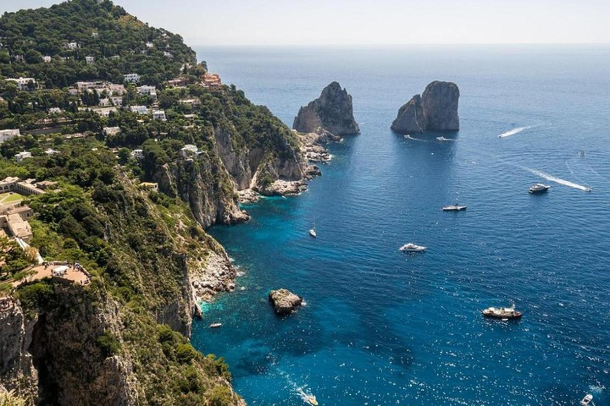 a large body of water with rocks and boats