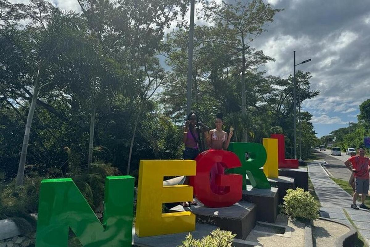 two people standing in front of a sign that says wow