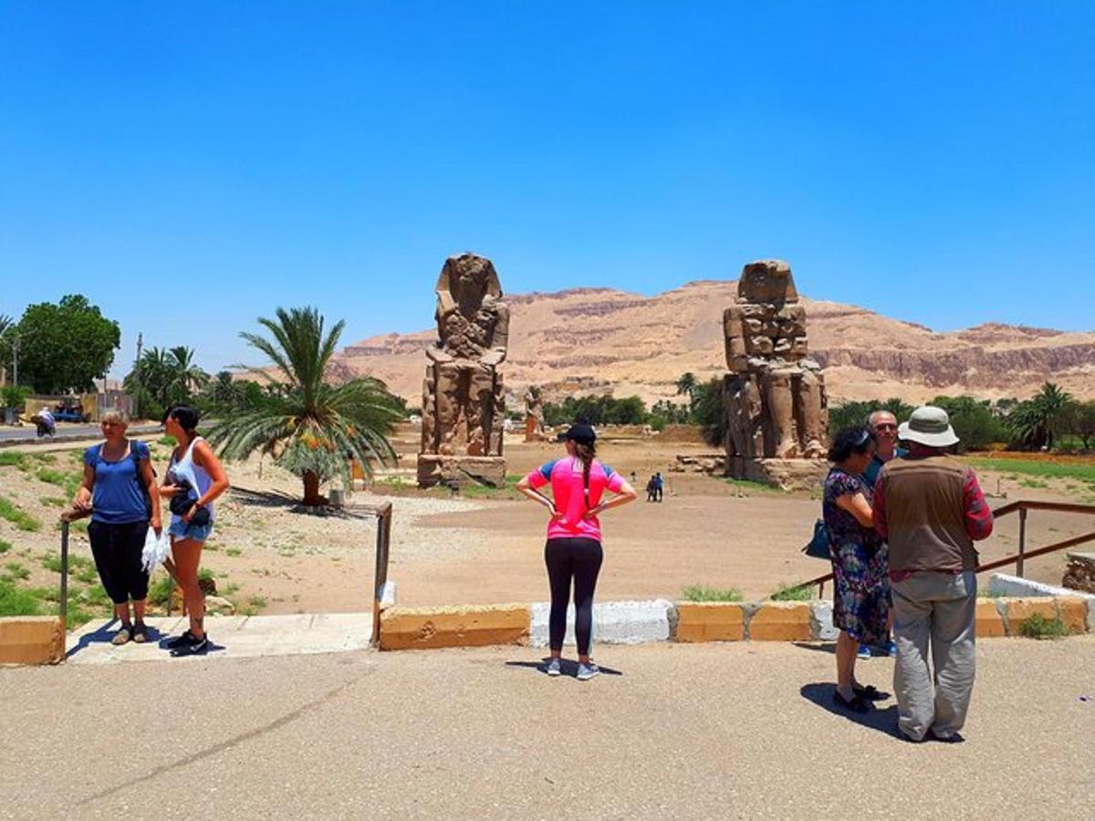 a group of people standing in front of a temple