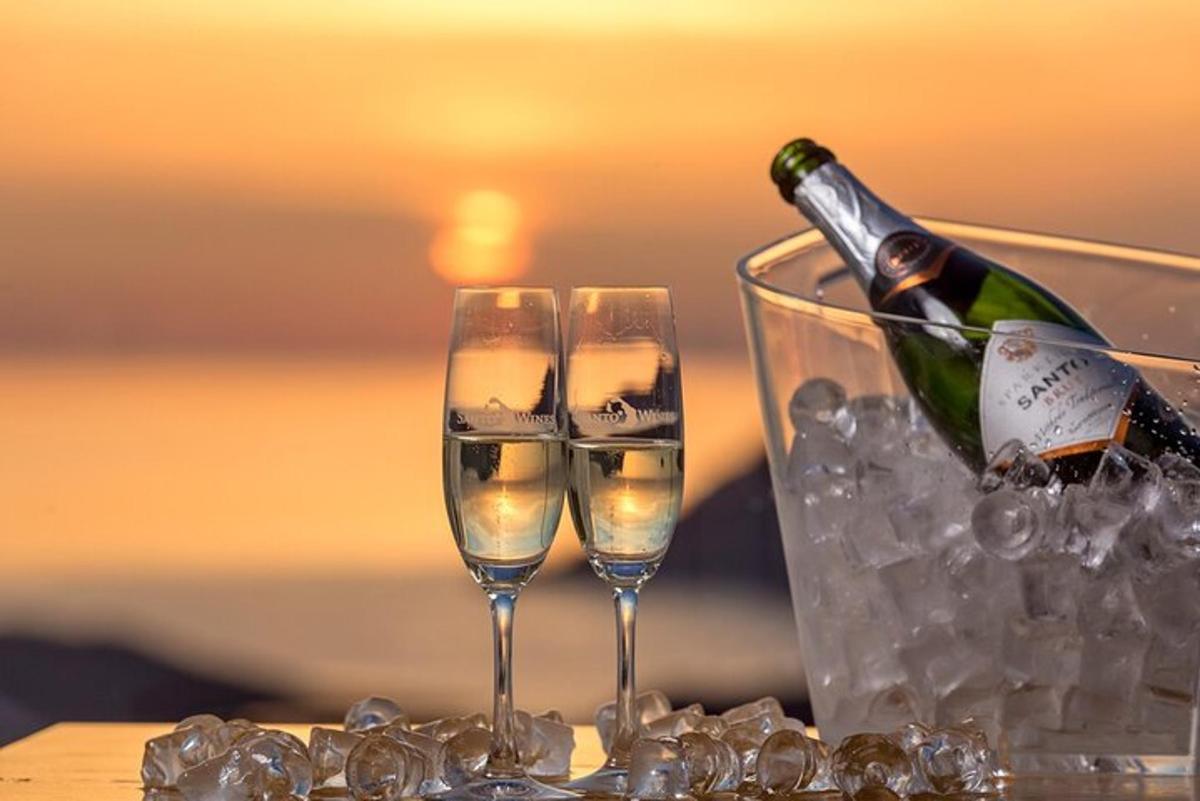 a bottle of champagne and two glasses on a table