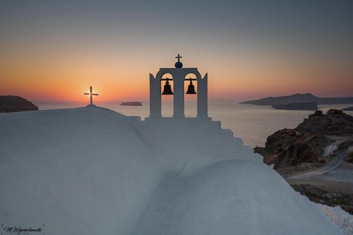 a church with a cross on top of a snowy hill