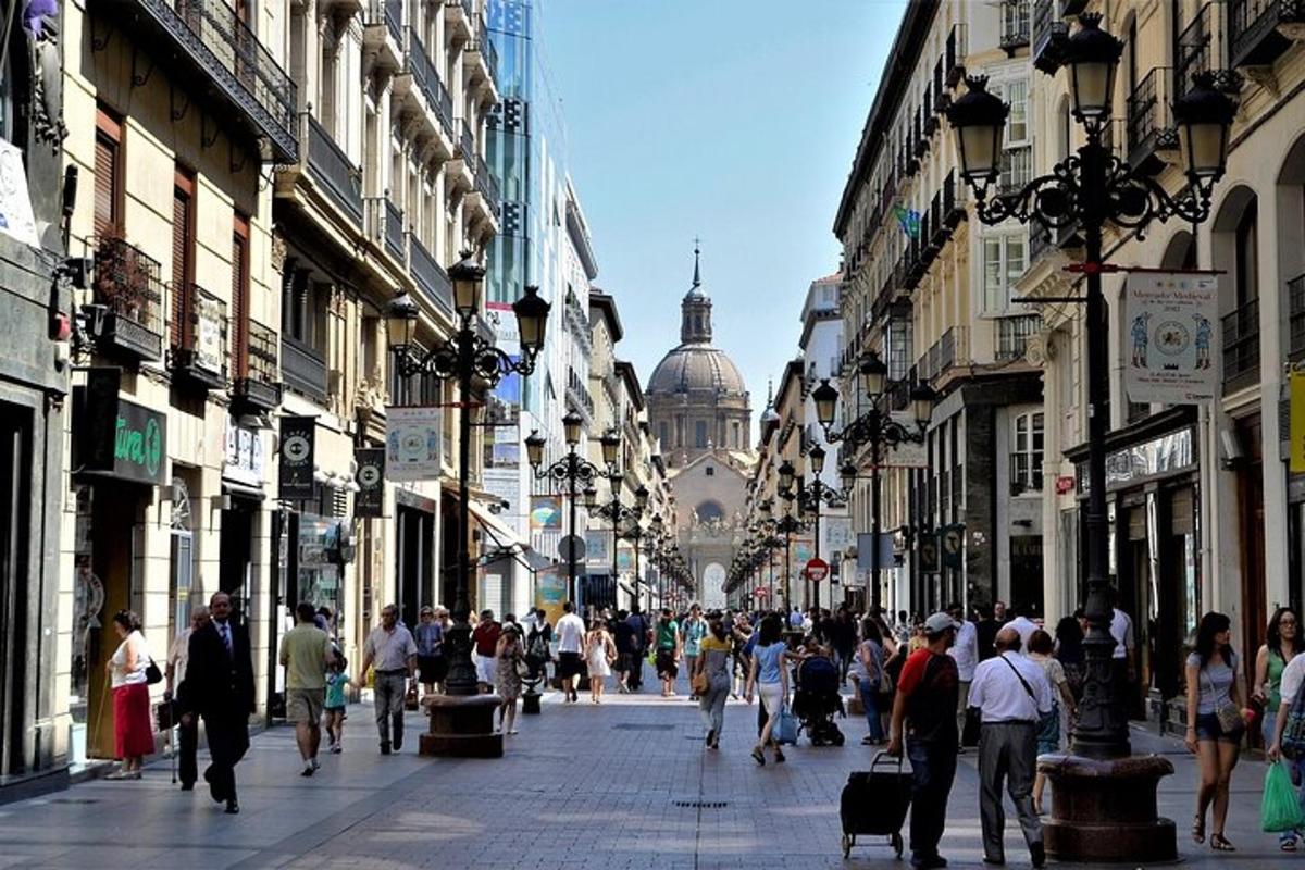 a crowd of people walking down a busy city street